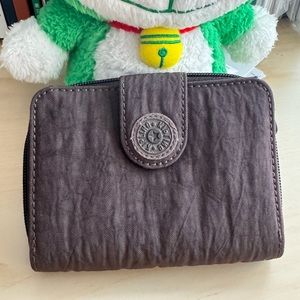 Kipling 4”x5” brown folding zip around and snap wallet